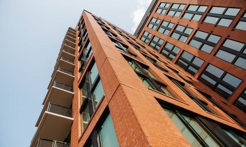 Photo of building exterior showcasing the height of the building